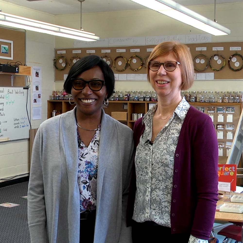 Alison Coulman and Abena Opoku standing together in their classroom